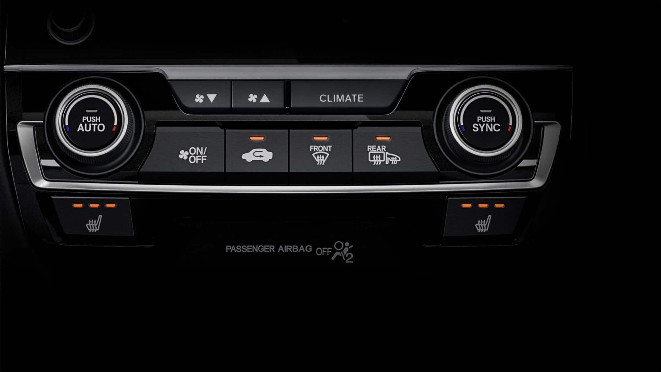 Detalle de controles de asientos calefaccionados en el Honda Civic Sport Touring Hatchback 2021.